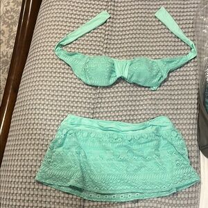 Two piece Antonio Melani swimsuit
Good used condition 
Medium top; Large bottom